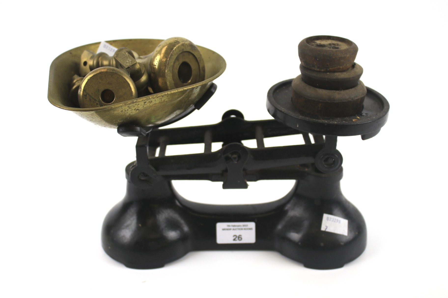 A vintage cast metal set of kitchen balance scales.