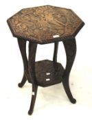 A carved chinoiserie occasional table.