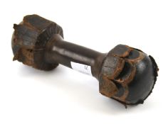 A vintage leather clad dumbbell weight.