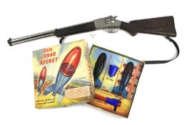A vintage Merit 'Lunar Rocket' and a Gonher toy rifle.