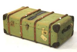 A large mid-century canvas and wooden bound travelling trunk.