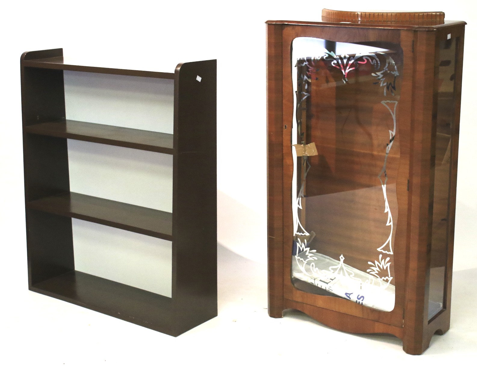 A modern brown painted bookcase and a mid-century style display cabinet.