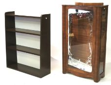 A modern brown painted bookcase and a mid-century style display cabinet.