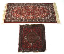 A Persian style floor rug and a child's prayer mat.