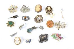 An assortment of vintage brooches.