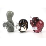 Three Wedgwood glass paperweights. Comprising an elephant, squirrel and a snail,