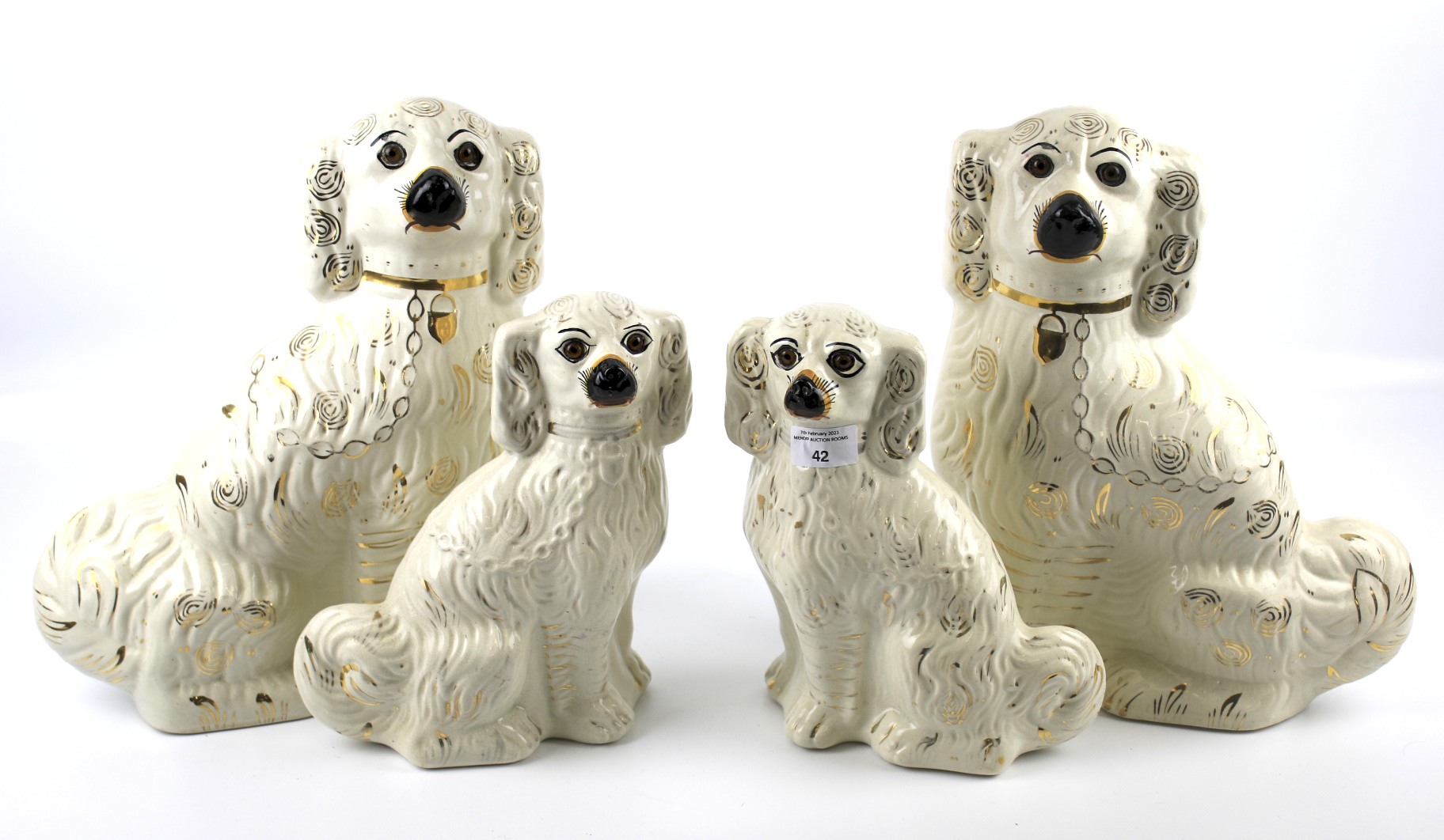 Two pairs of Staffordshire spaniels.