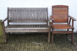 A Rowlinson teak garden bench and a teak garden seat.