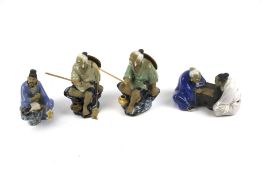 Four 20th century Chinese ceramic figures.