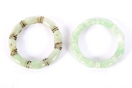 Two Chinese pale green hardstone bangles.