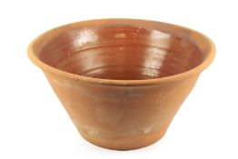 A large terracotta bowl with glazed interior.