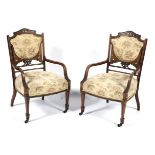 A pair of Edwardian inlaid mahogany bedroom chairs.