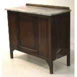 An Edwardian marble top wash stand cupboard.