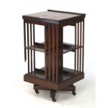 An Edwardian mahogany revolving floor standing bookcase.