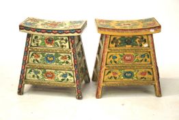 Two polychrome painted wooden stools. Each with three integral storage drawers.