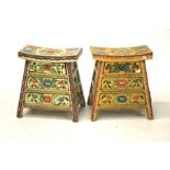 Two polychrome painted wooden stools. Each with three integral storage drawers.