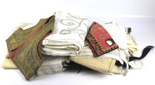 A collection of assorted vintage clothing and fabric samples.