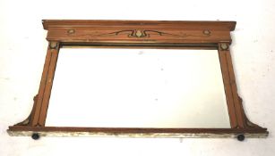 An Art Noveau style rectangular overmantel bevel edge mirror. With inlaid floral detail.