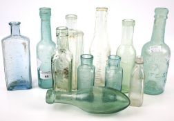 Collection of assorted vintage glass bottles.