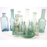 Collection of assorted vintage glass bottles.