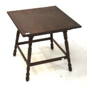 An Edwardian square top mahogany table.