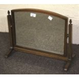 A dressing table swing mirror. Arch top, oak framed on stand with acorn finials, 39cm high.