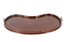 An Edwardian mahogany kidney-shaped two-handled tray.