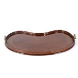 An Edwardian mahogany kidney-shaped two-handled tray.