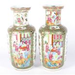 A pair of 19th century Canton famille rose rouleau shaped vases.