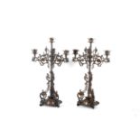 A pair of Victorian Gothic Revival iron and copper candelabra, circa 1880.