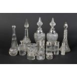 A group of Victorian and Edwardian silver mounted glass perfume bottles and powder boxes.