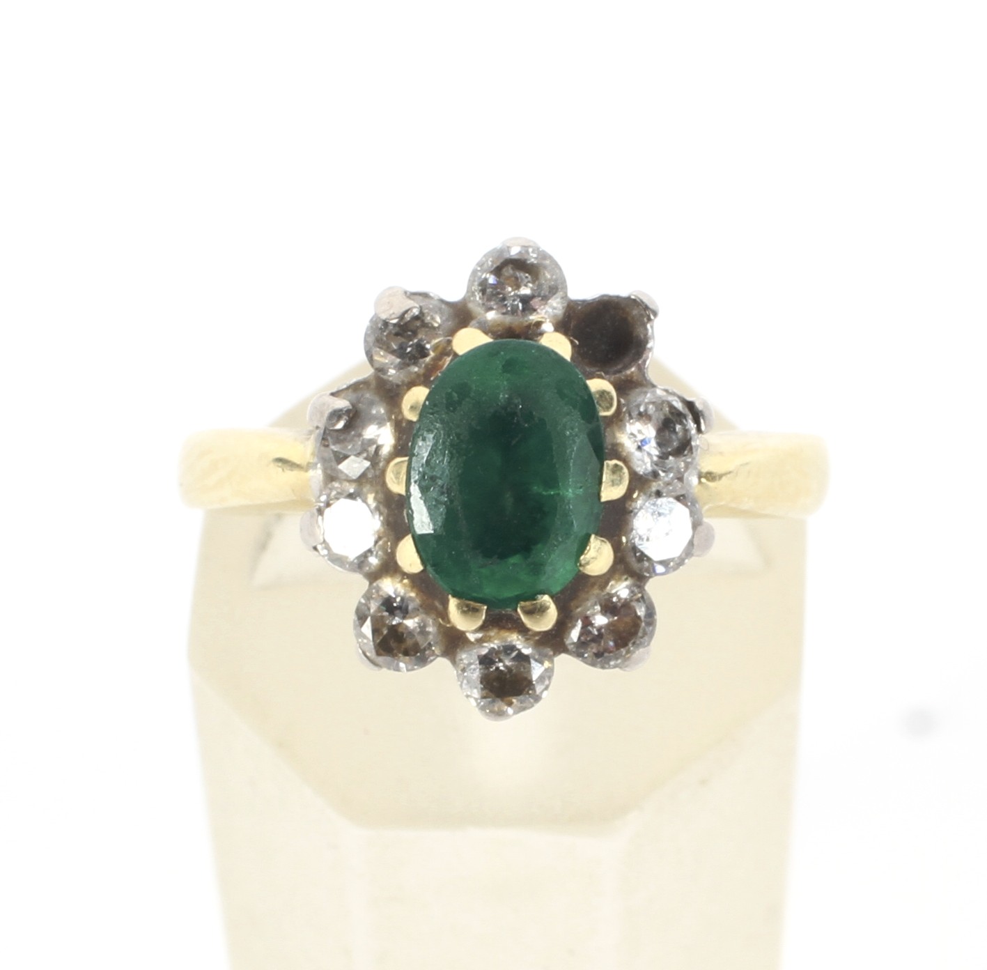 A modern 18ct gold, emerald and diamond oval cluster ring. - Image 2 of 4