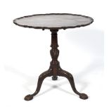 An early 20th century circular piecrust tilt top tripod table.