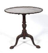 An early 20th century circular piecrust tilt top tripod table.
