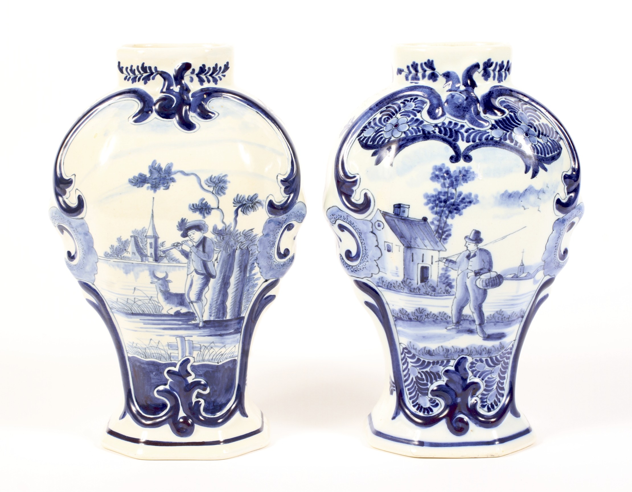 A pair of Dutch Delft blue and white inverted baluster vases, circa 1900.