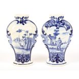 A pair of Dutch Delft blue and white inverted baluster vases, circa 1900.