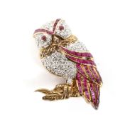 A vintage ruby and diamond brooch in the form of an owl.