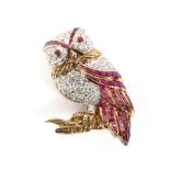 A vintage ruby and diamond brooch in the form of an owl.