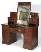 A fine Art Nouveau mahogany twin pedestal swing mirror dressing table.