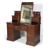 A fine Art Nouveau mahogany twin pedestal swing mirror dressing table.