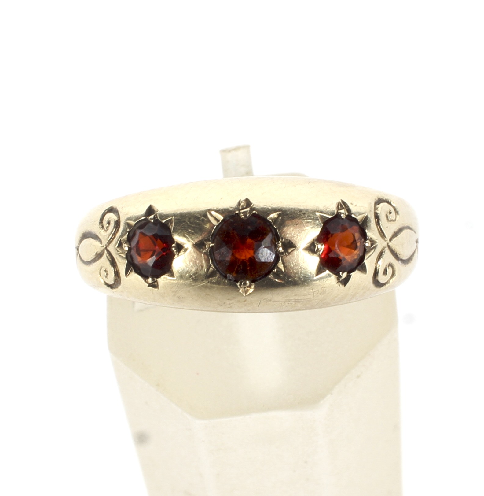 A vintage 9ct gold and garnet three stone gypsy ring. - Image 2 of 4