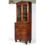 An early 19th century mahogany glazed bookcase.