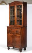 An early 19th century mahogany glazed bookcase.