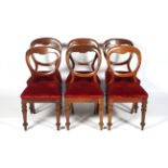 A set of six Victorian mahogany balloon back dining chairs.