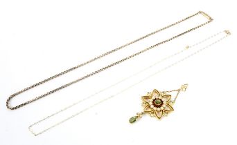 An Edwardian gold, peridot and half-pearl open hexafoil pendant.