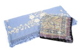 A vintage Liberty of London silk paisley pattern scarf and a pale blue embroidered shawl.