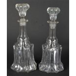 A near-pair of mid-19th century decanters and stoppers.