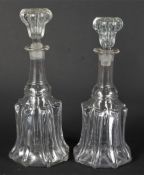 A near-pair of mid-19th century decanters and stoppers.