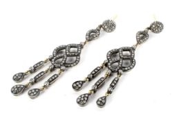 A pair of modern diamond pendent earrings in girandole style.