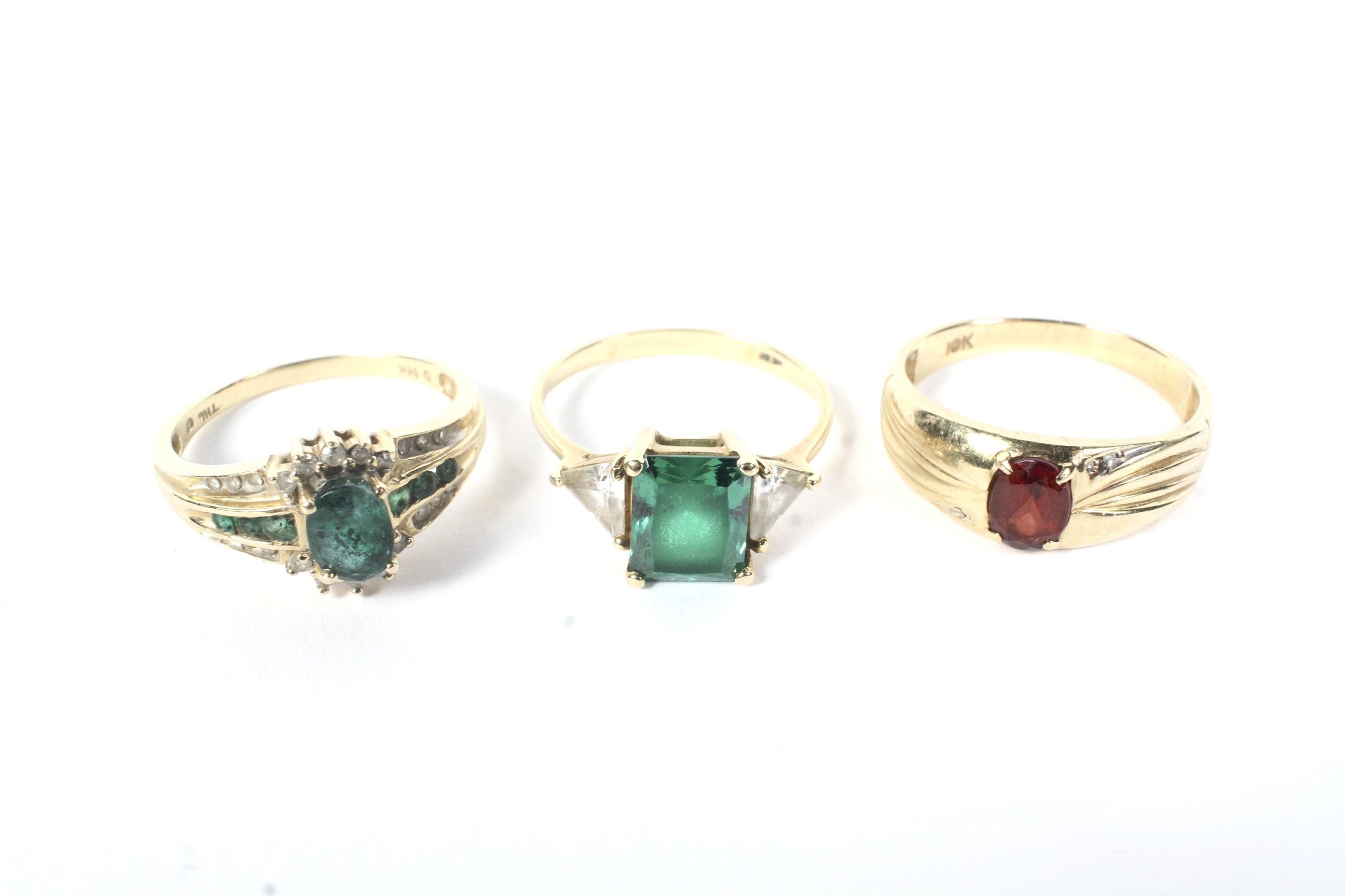 Three gem set dress rings.